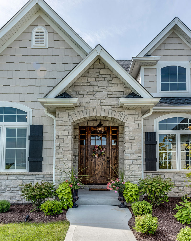 Front View of a Family Home After Siding and Roofing Work