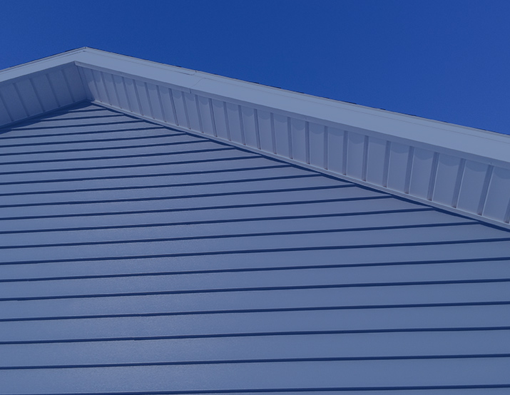 Siding Work Near the Roof Line of a Home